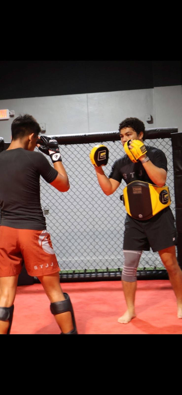 Teen working Muay Thai & MMA pad striking at South Tampa Jiu-Jitsu